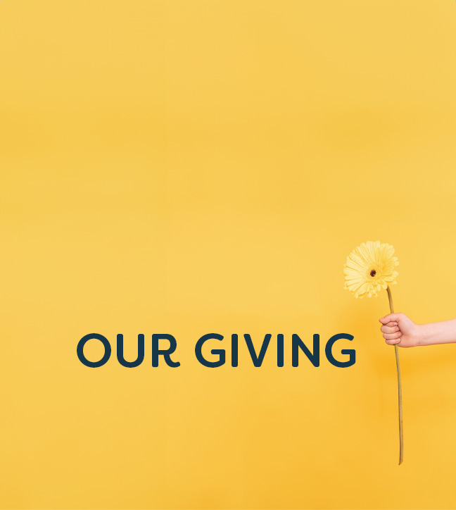 Hand holding a flower against a yellow background with 'Our Giving' text overlay.