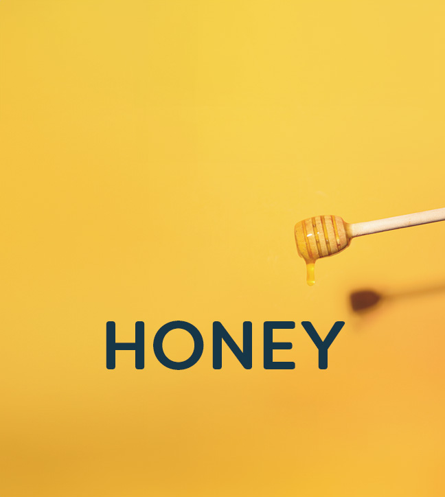 Wooden honey dipper dripping honey against a yellow background with 'Honey' text overlay.