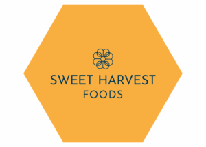 Sweet Harvest Foods logo on gold hexagon.