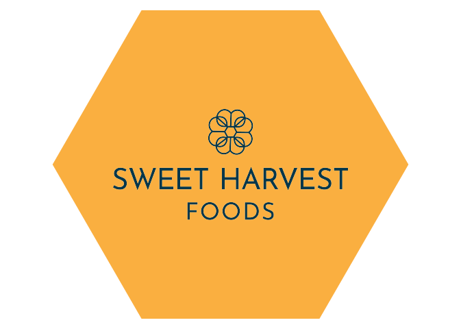 Sweet Harvest Foods logo on gold hexagon.