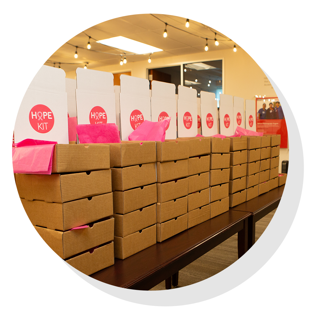 Boxes of hope kits and pink stickers.