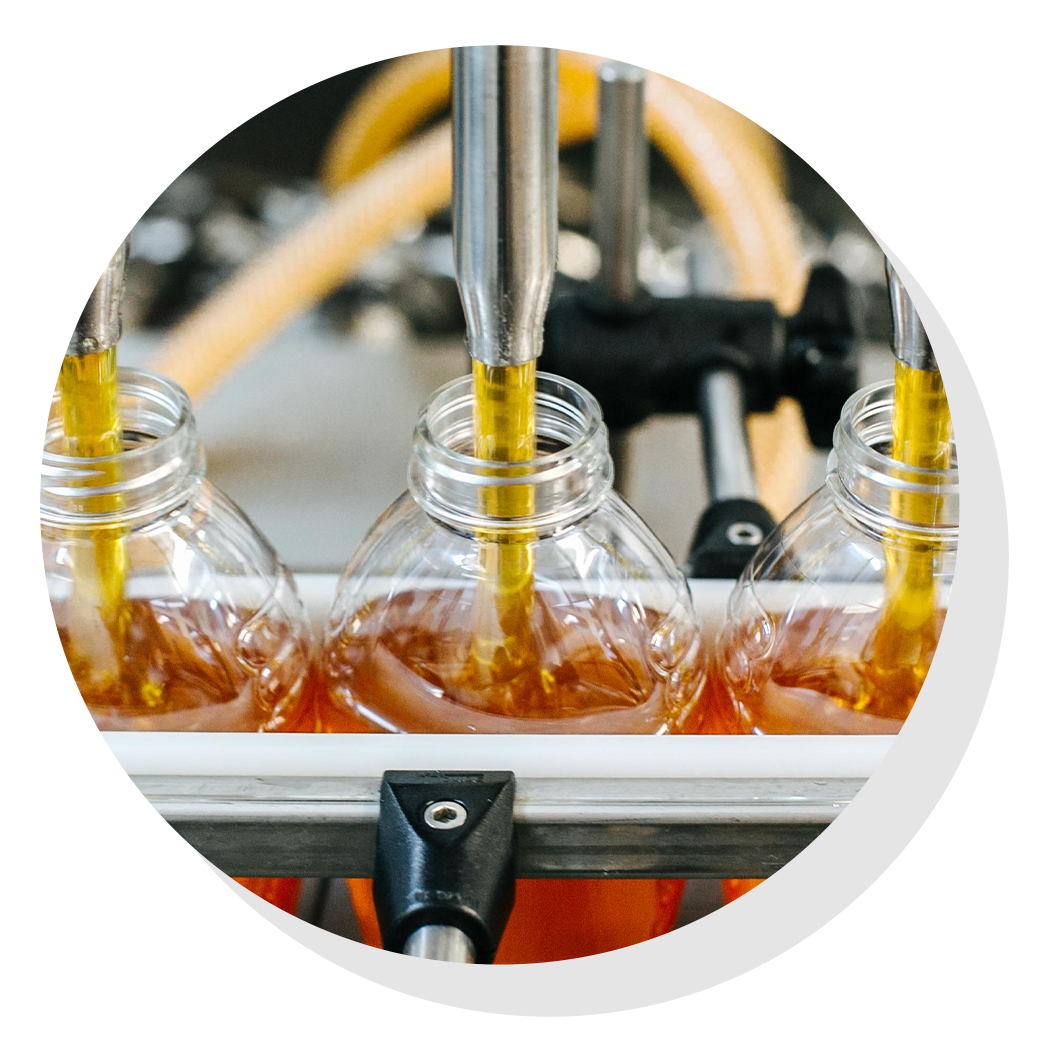Honey bottles on assembly line.